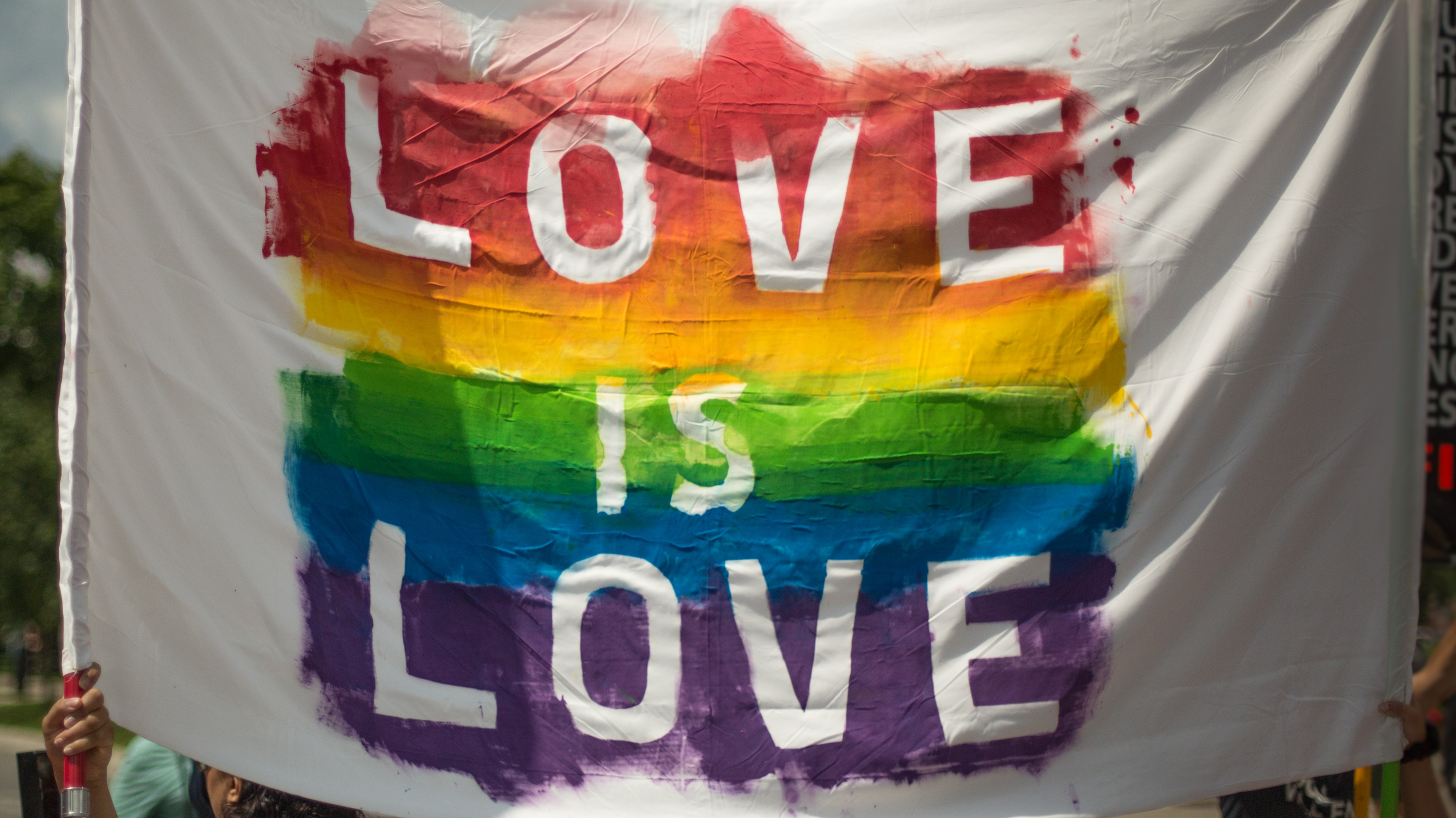 Love is Love sign with rainbow
