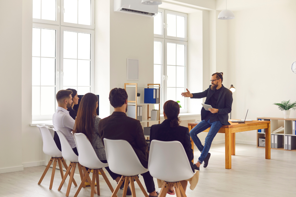 Business owner presenting manufacturing plans to supplement brand team in office