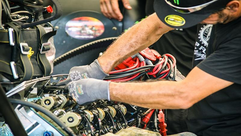 Mechanic working on car's electrical wiring