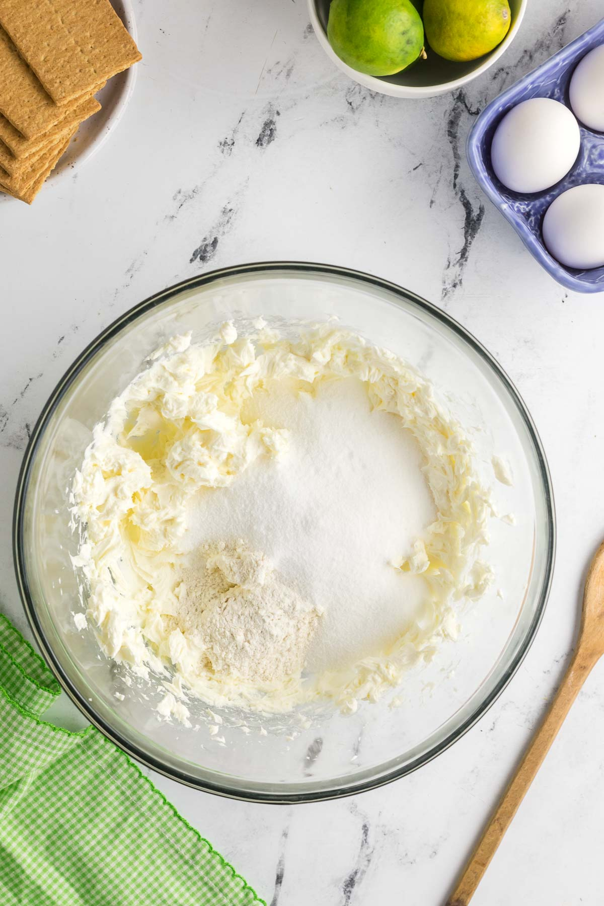 flour, sugar, and salt added to beaten cream cheese mixture in bowl