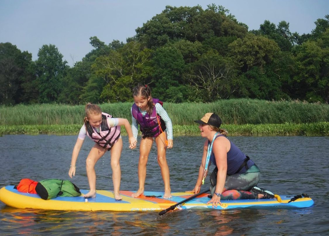 kids on a stand up paddleboard