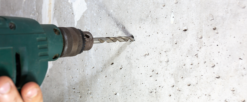 Drilling holes in concrete or brick may require specialist tools and protection.