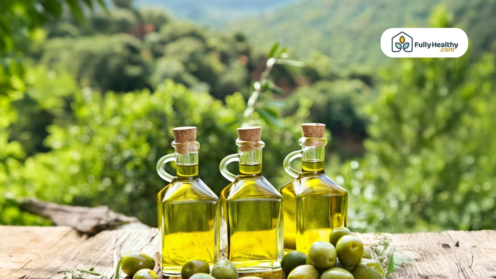 Three glass olive oil bottles with green olives on wooden surface