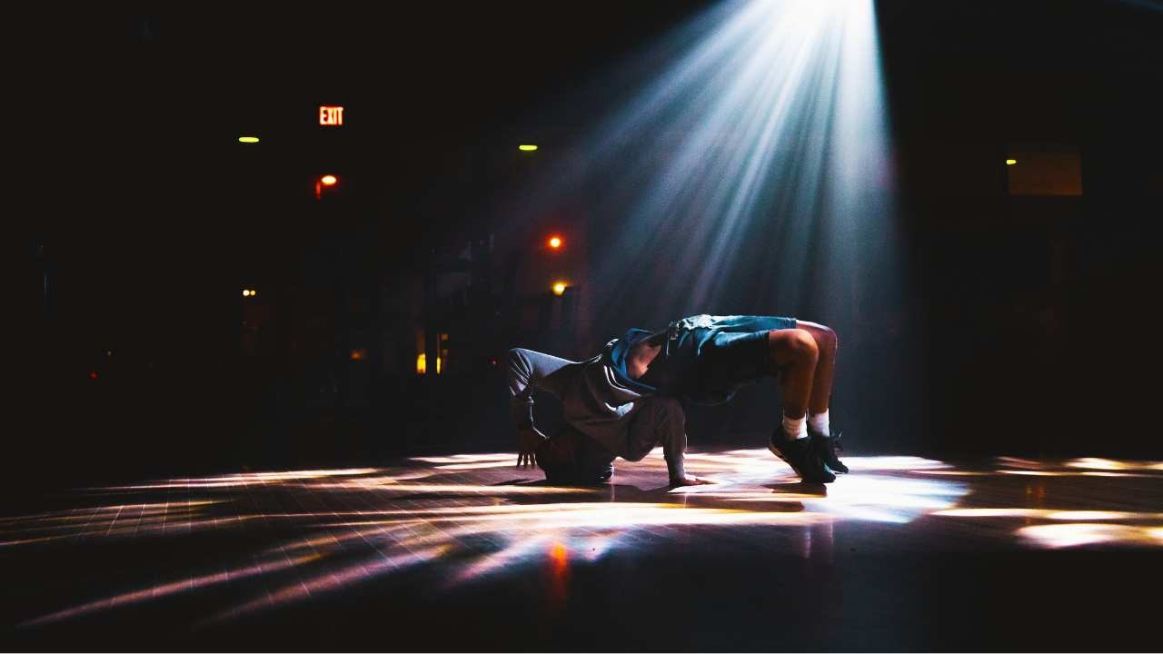 a person dancing under a light