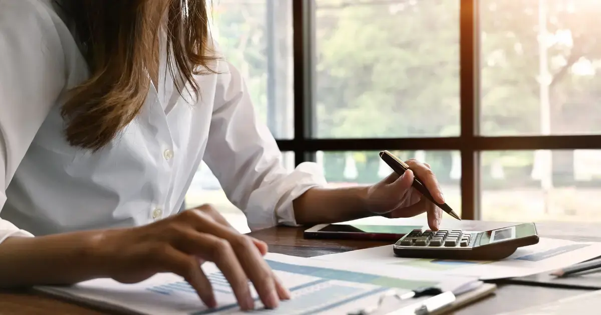 Woman reviewing Form 8857 instructions and tax documents for an innocent spouse relief request.