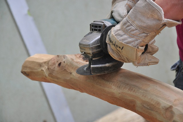 An angle grinder smoothing wood.