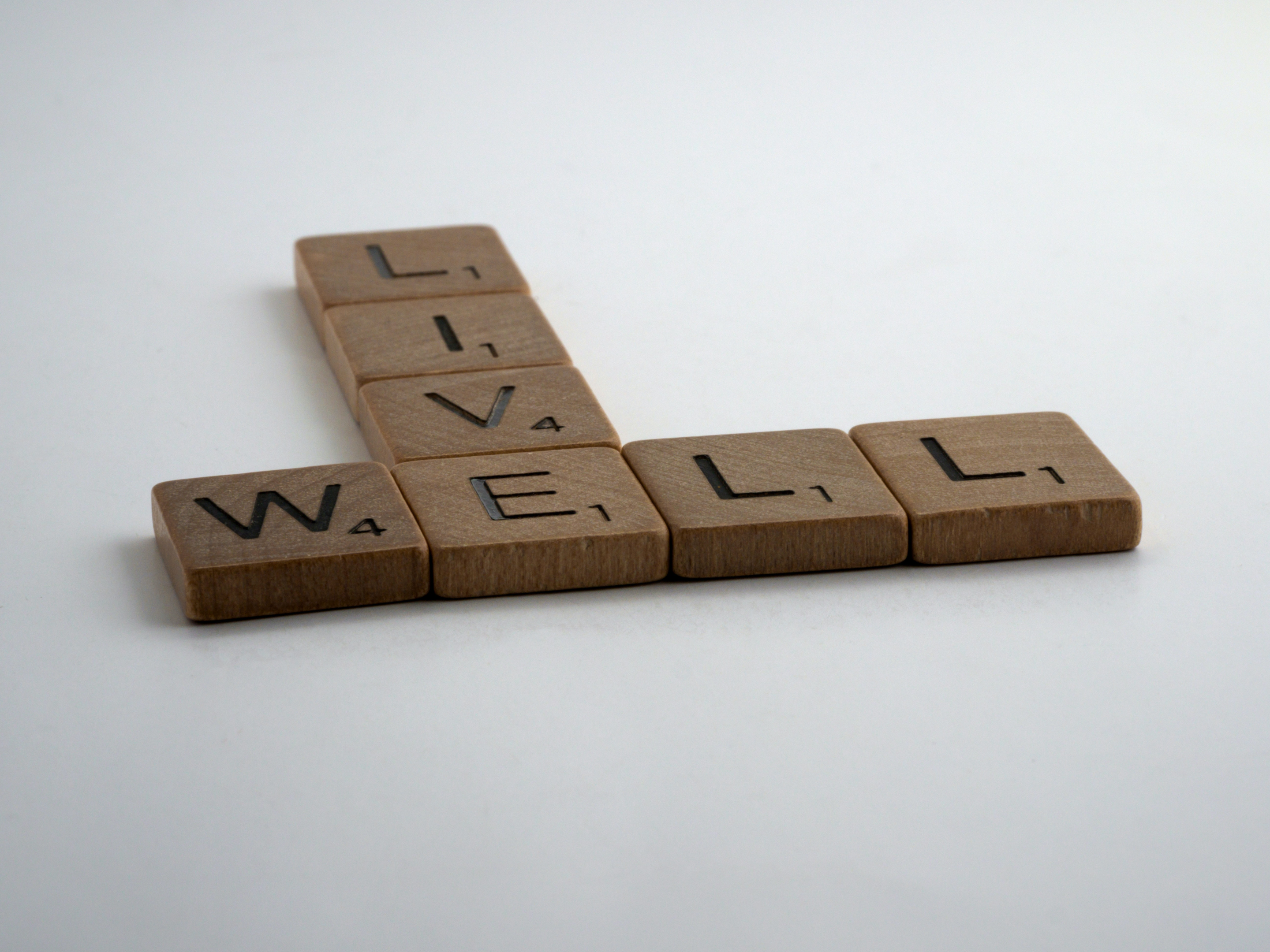 tiles that spell live well like scrabble