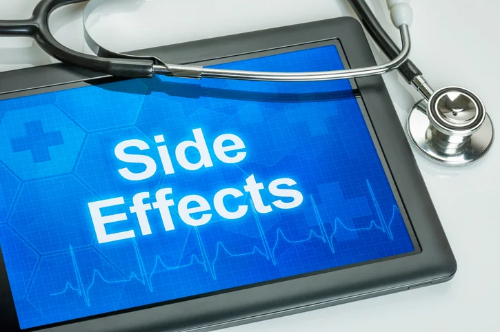 Tablet with the phrase side effect written on it and a stethoscope