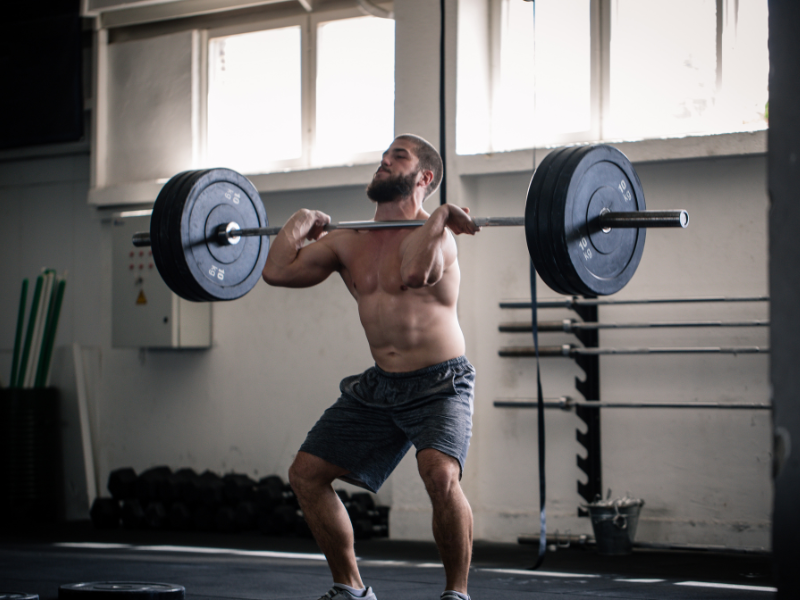 An image showing creatine supplements and a muscular person during weight lifting.