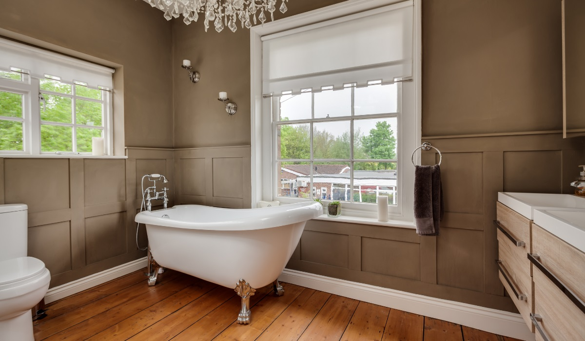 Impressive vintage modern bathroom design - done with great care - roll top bath - lots of day light