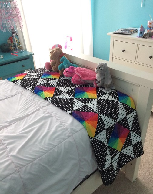 Lucy in the Sky quilt on a twin bed.