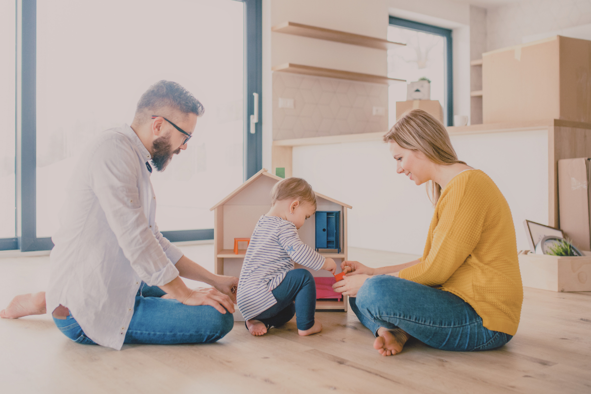 Parents playing with their child