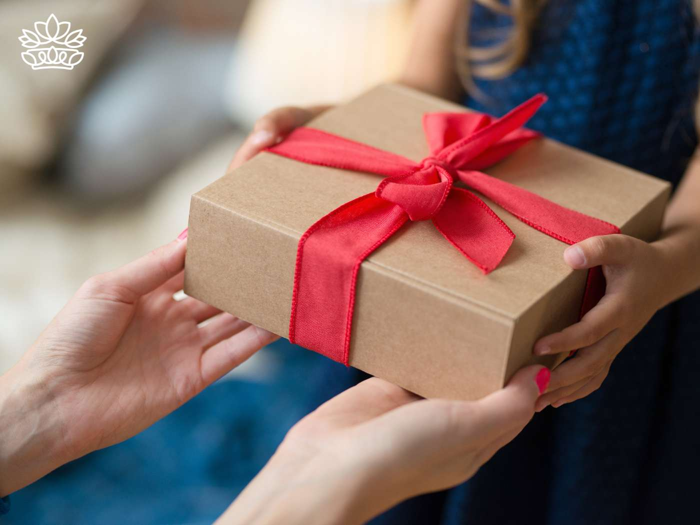 Close-up of a person's hands exchanging a beautifully wrapped gift box, embodying the art of giving within a budget, and adding a touch of magic to the moment. Part of the Gift Boxes Collection from Fabulous Flowers and Gifts.