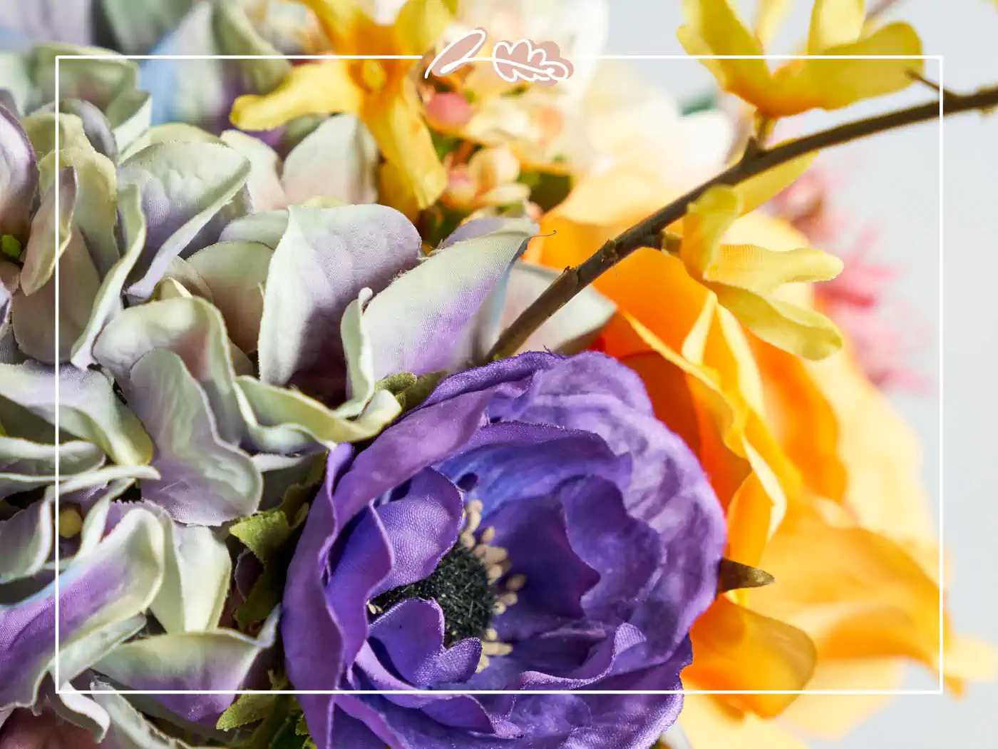 Close-up of purple artificial flowers amidst a colourful arrangement - Fabulous Flowers and Gifts.