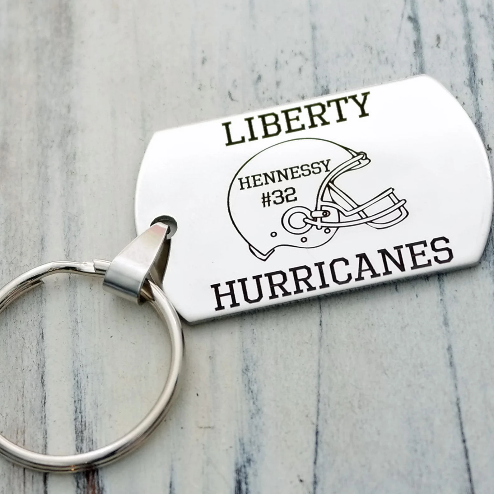 The best football gifts don't have to be expensive! Consider a football keychain or mug.