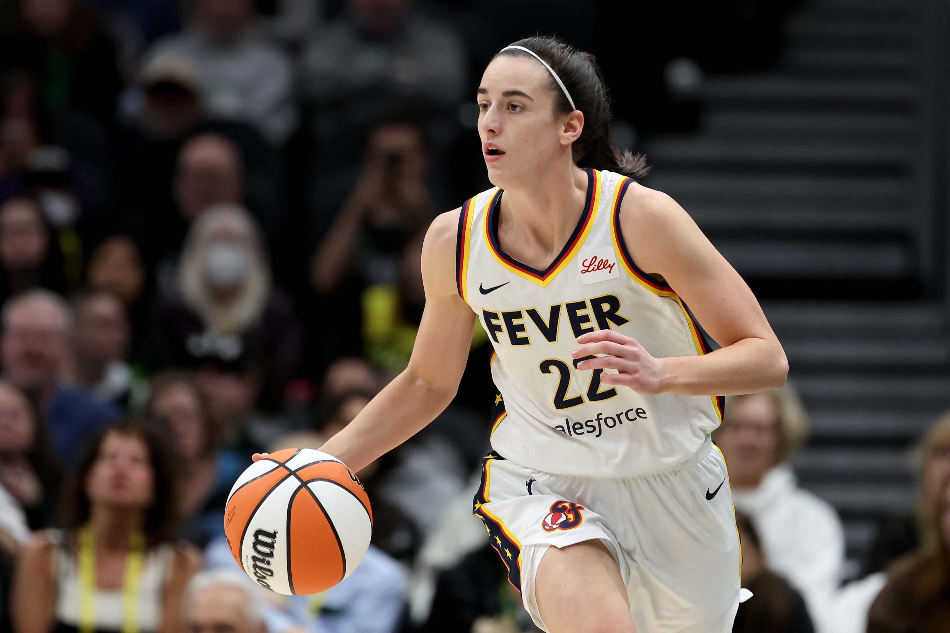 Caitlin Clark #22 of the Indiana Fever dribbles against the Seattle Storm in May, 2024 in Seattle, Washington