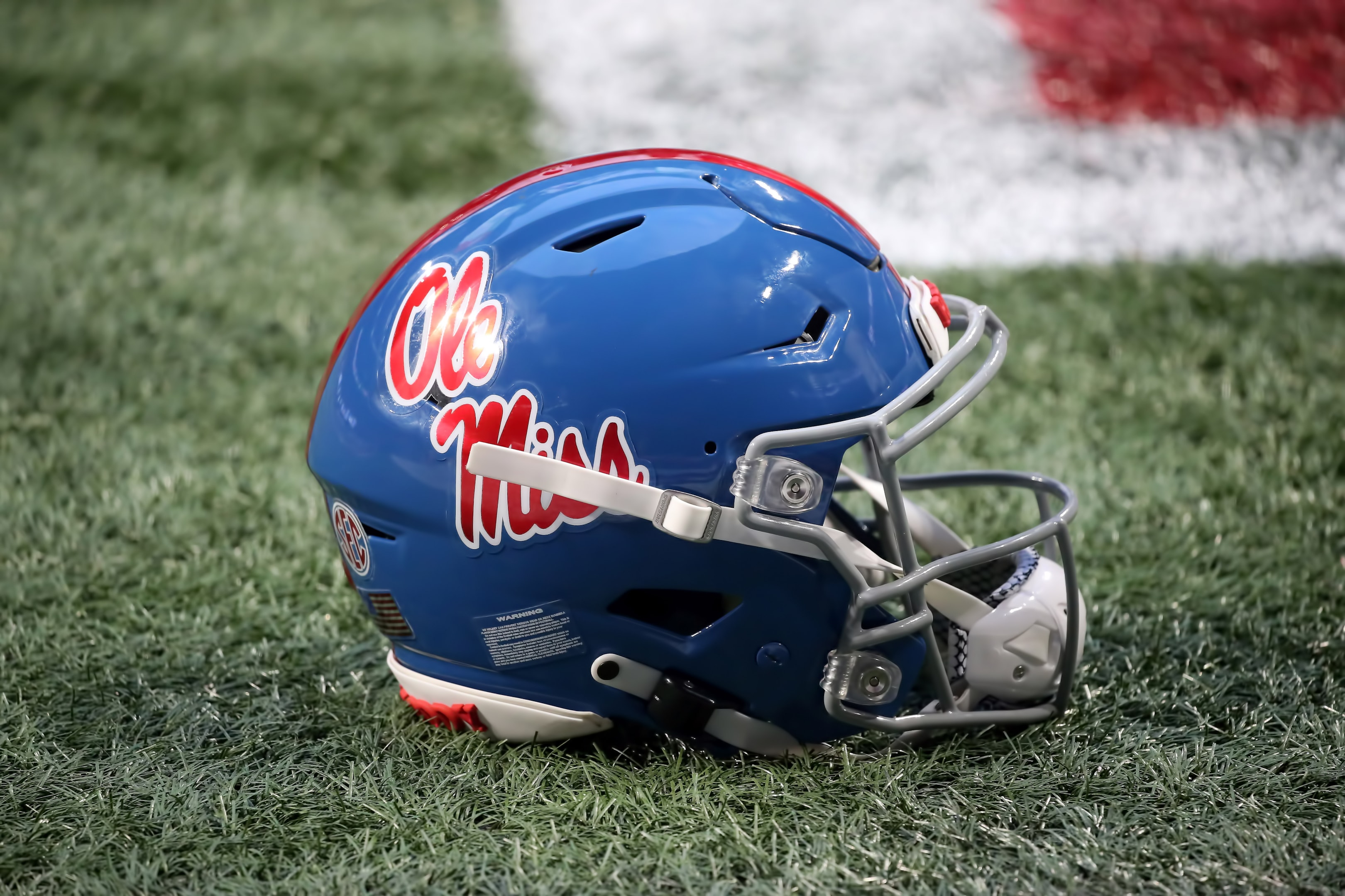 A Mississippi Rebels helmet rests on the field during at Mercedes Benz Stadium in Atlanta, Georgia.