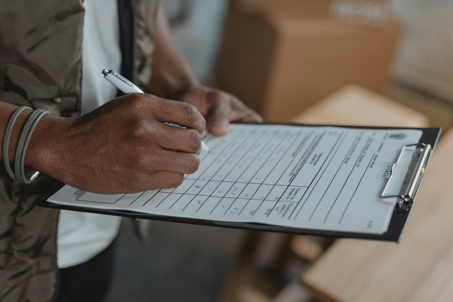 A professional holding a clipboard with checklist.
