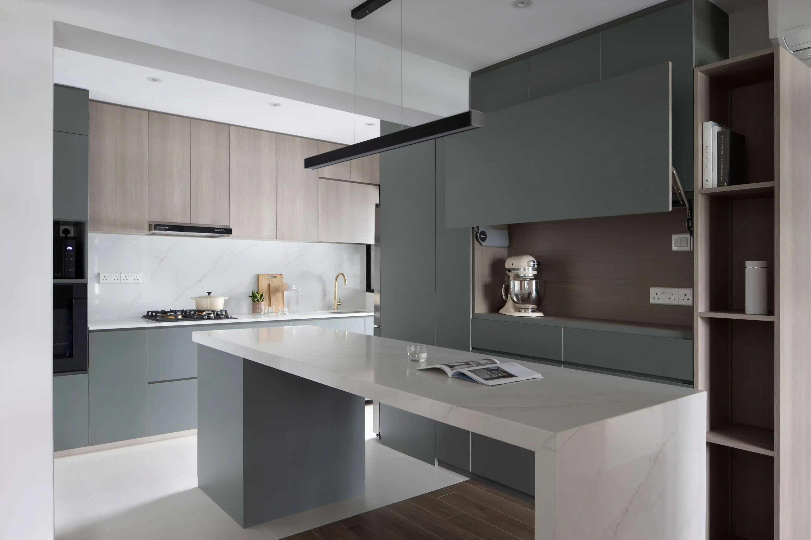 Modern minimalist interior design kitchen with marble waterfall island and handleless cabinets in warm neutral tones.