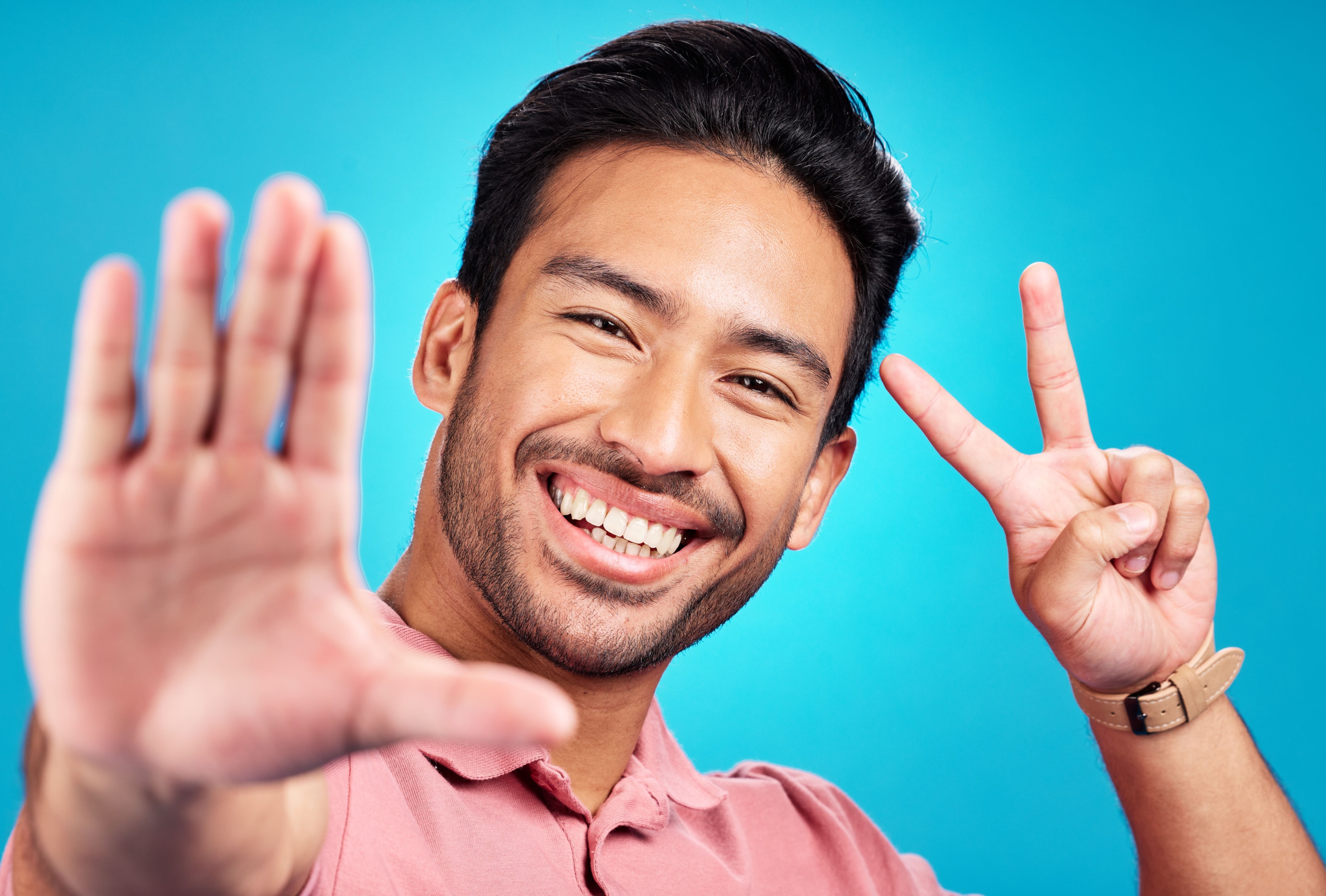 A young man smiling and happy during the healing process from his dental implant