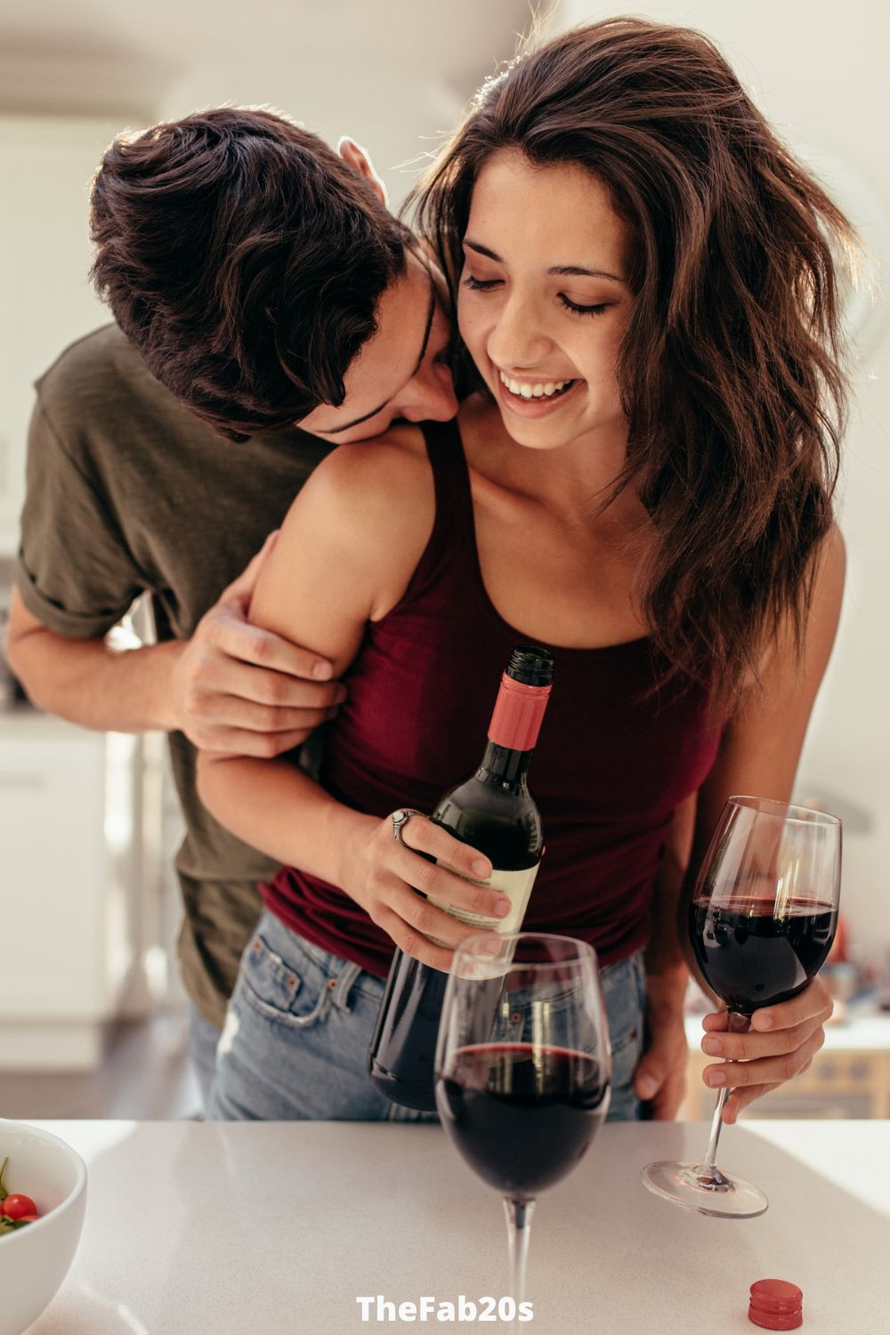 Couple being romantic with wine in front of them -  Featured In How To Know When A Leo Man Is Playing You