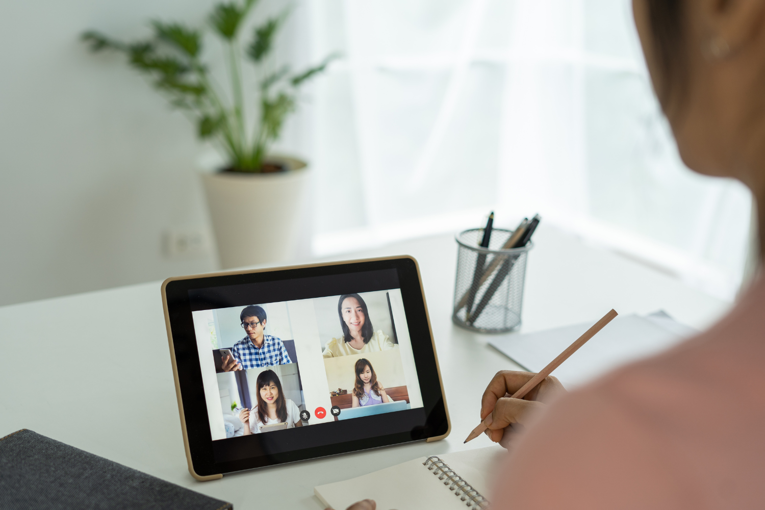 Small group of diverse employees in a virtual meeting.
