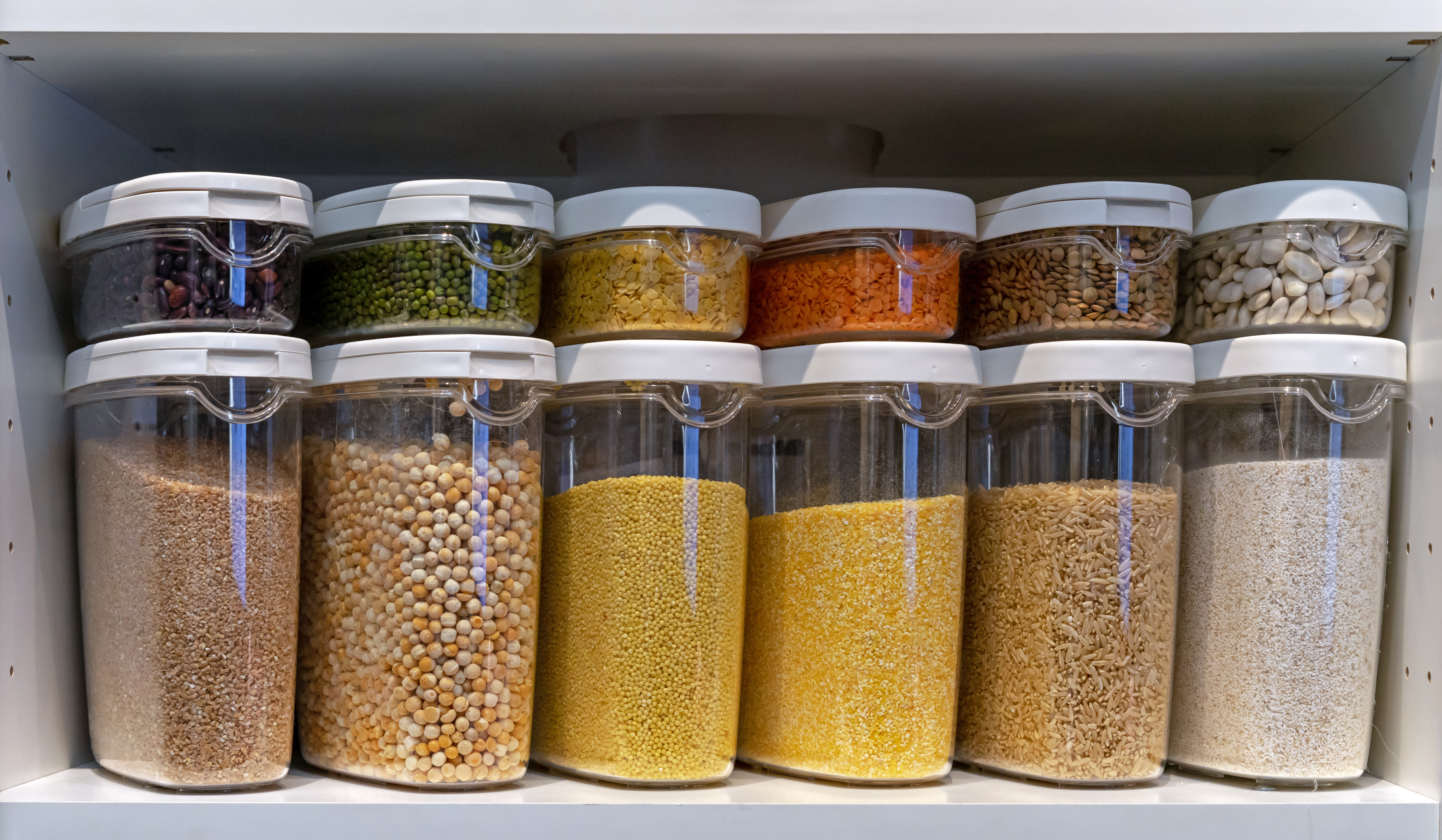 Save cabinet space in functional kitchen with organized spices.