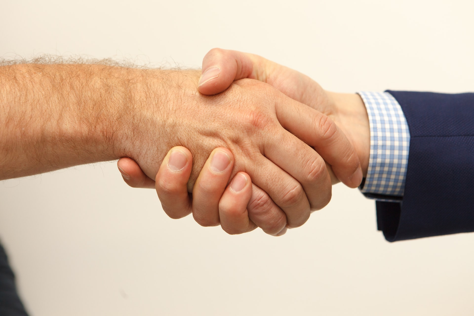 A firm hand shake that shows cooperation