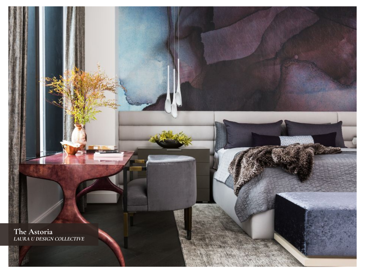 Moody bedroom at The Astoria featuring blue, purple, and plum wallcovering, an aubergine desk, gray upholstery, and layered textures.