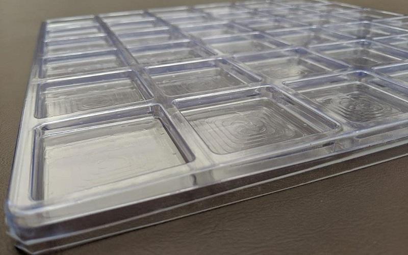 Vacuum formed plastic trays used in product packaging