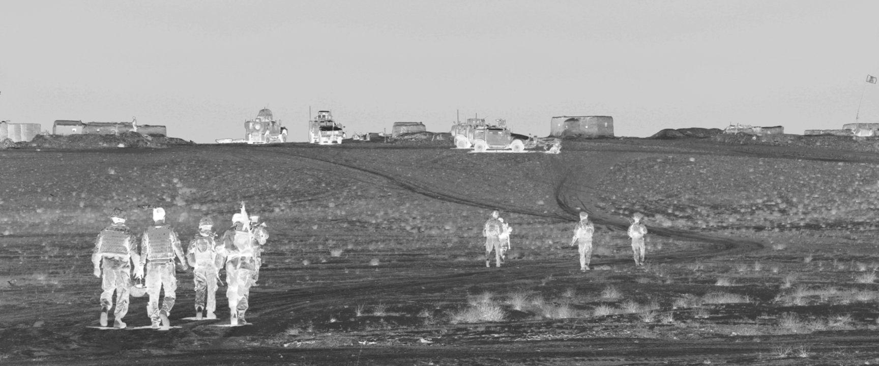 thermal camera image of people and vehicles