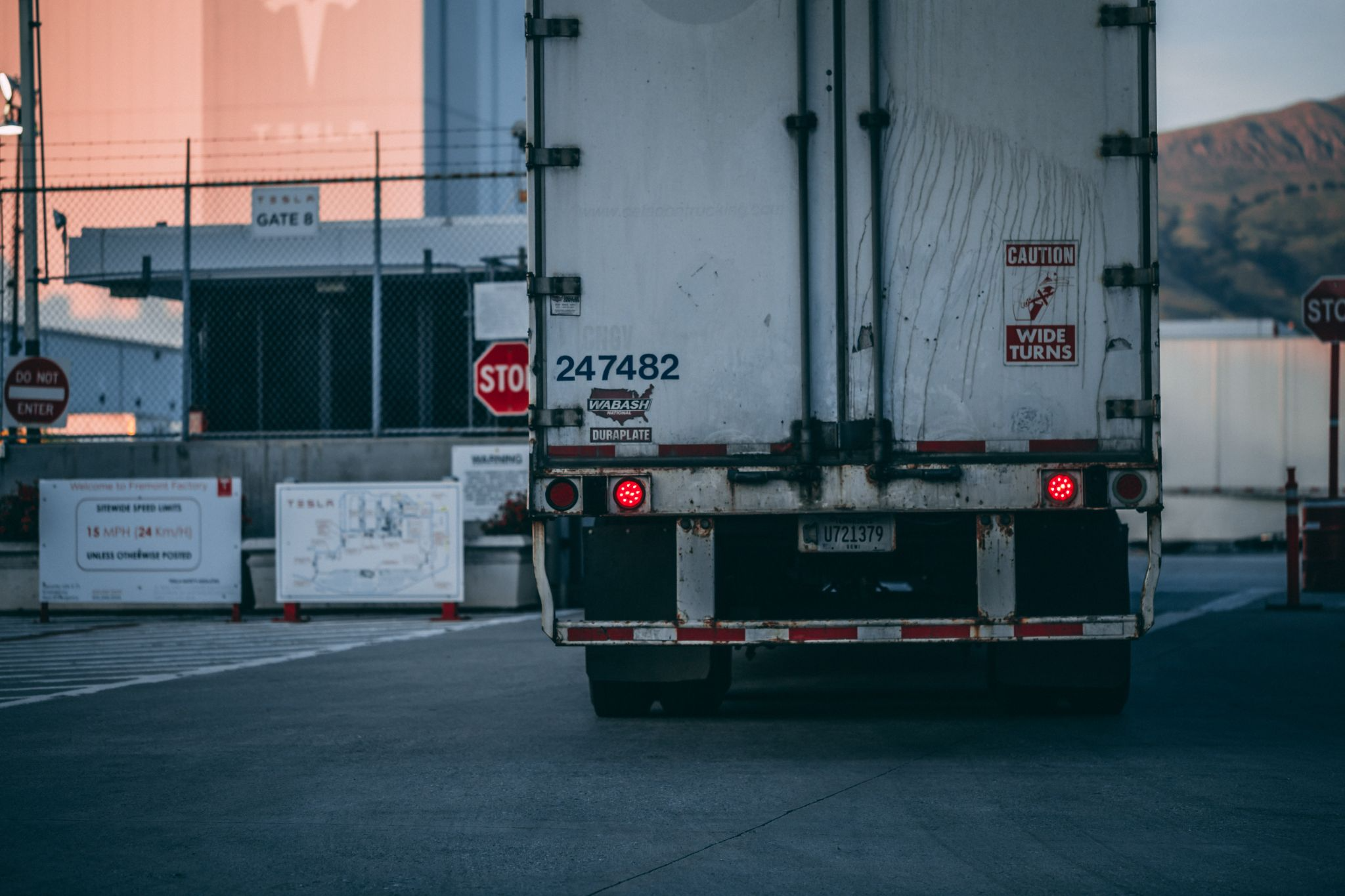 A semi truck at complete stop ready for an inspection