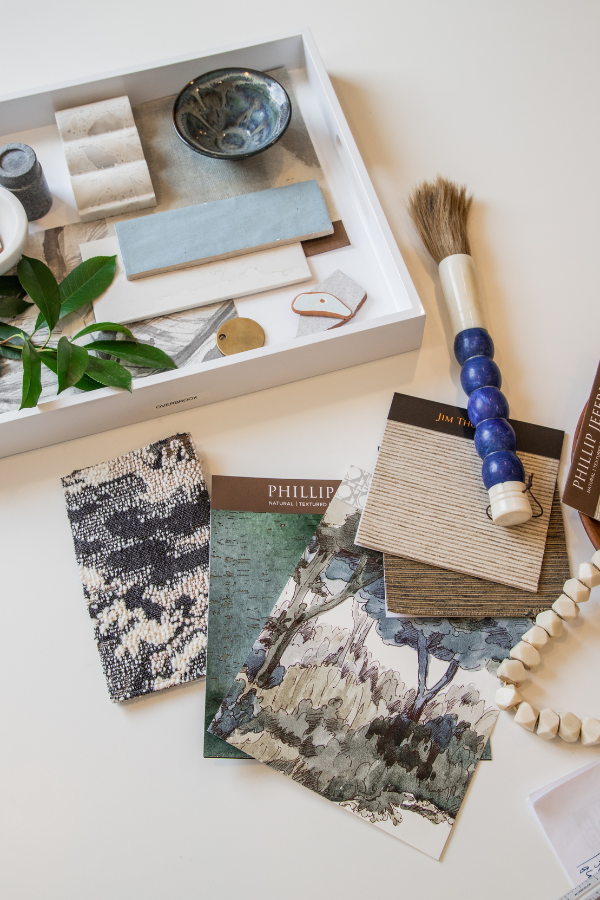 a mood board with fabric samples in an interior design firm