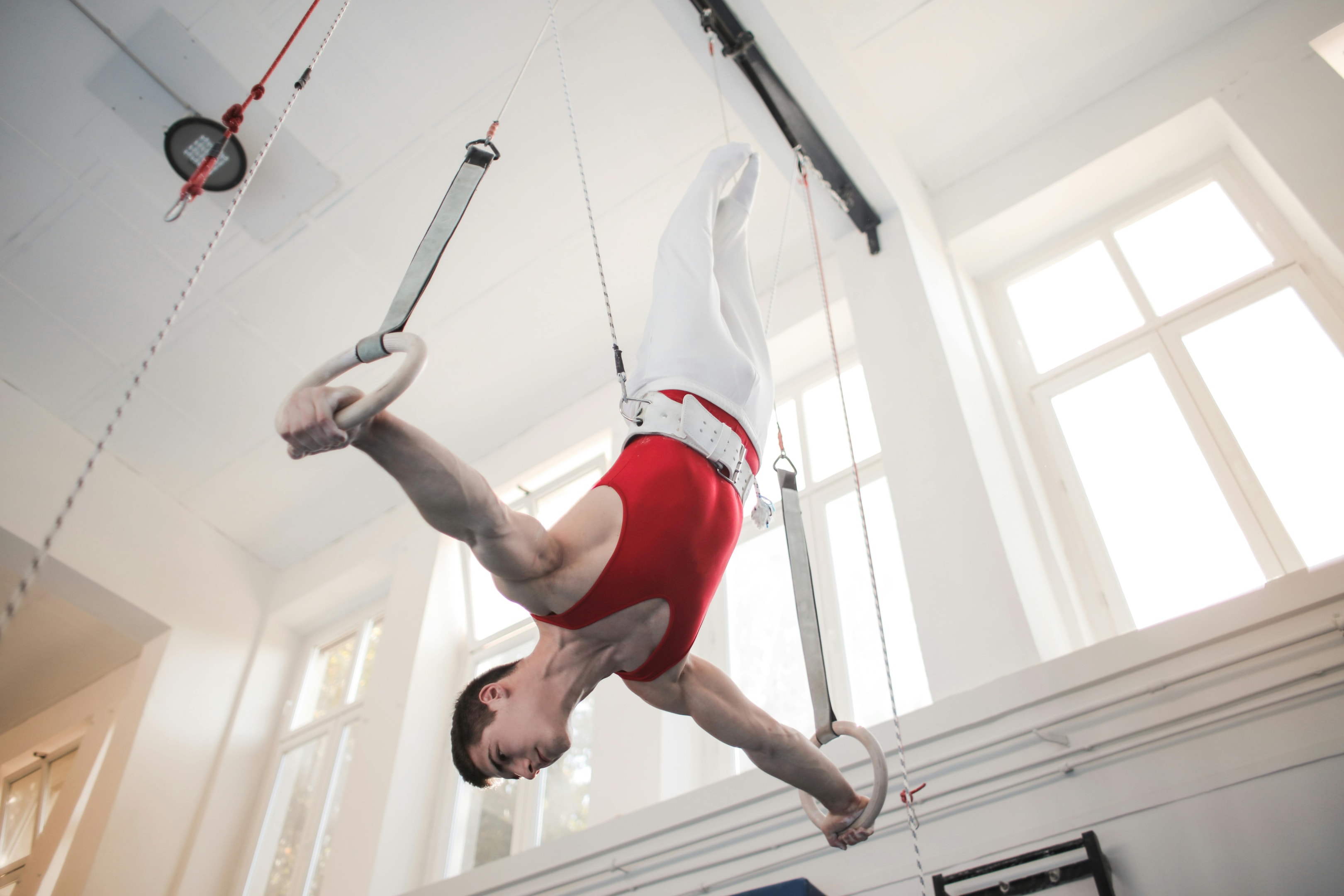 Photo by Andrea Piacquadio: https://www.pexels.com/photo/photo-of-male-gymnast-practicing-on-gymnastic-rings-3763699/