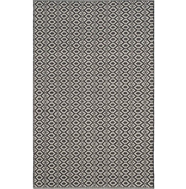 Black and ivory patterned rug