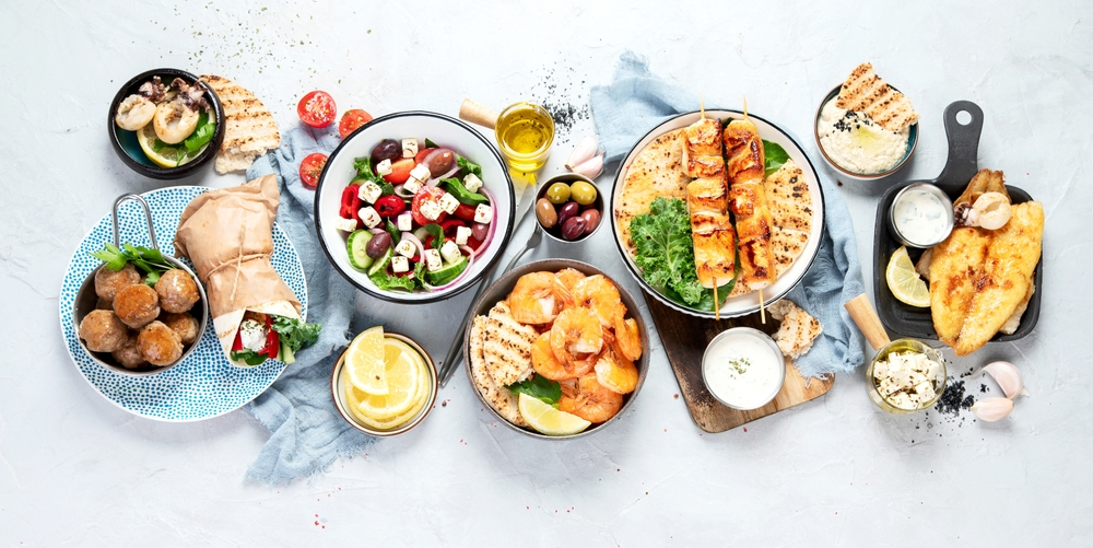 Shot from above of various dishes of healthy colorful food for nutritional psychiatry. Image credit Tatjana Baibakova