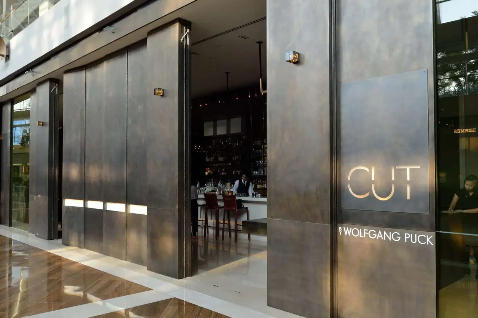 CUT by Wolfgang Puck Singapore steakhouse entrance and contemporary restaurant exterior