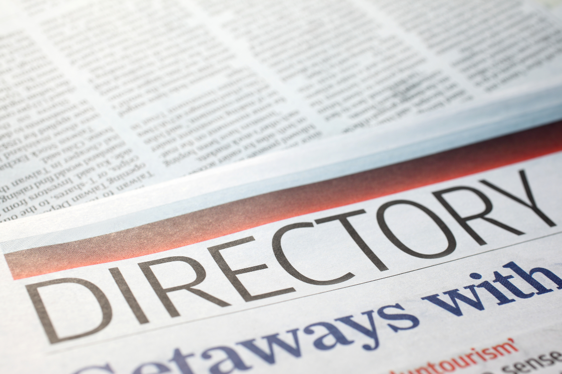Close-up of a newspaper page with the word "Directory" in bold, symbolizing broker directory listings in a broker sourcing comparison.