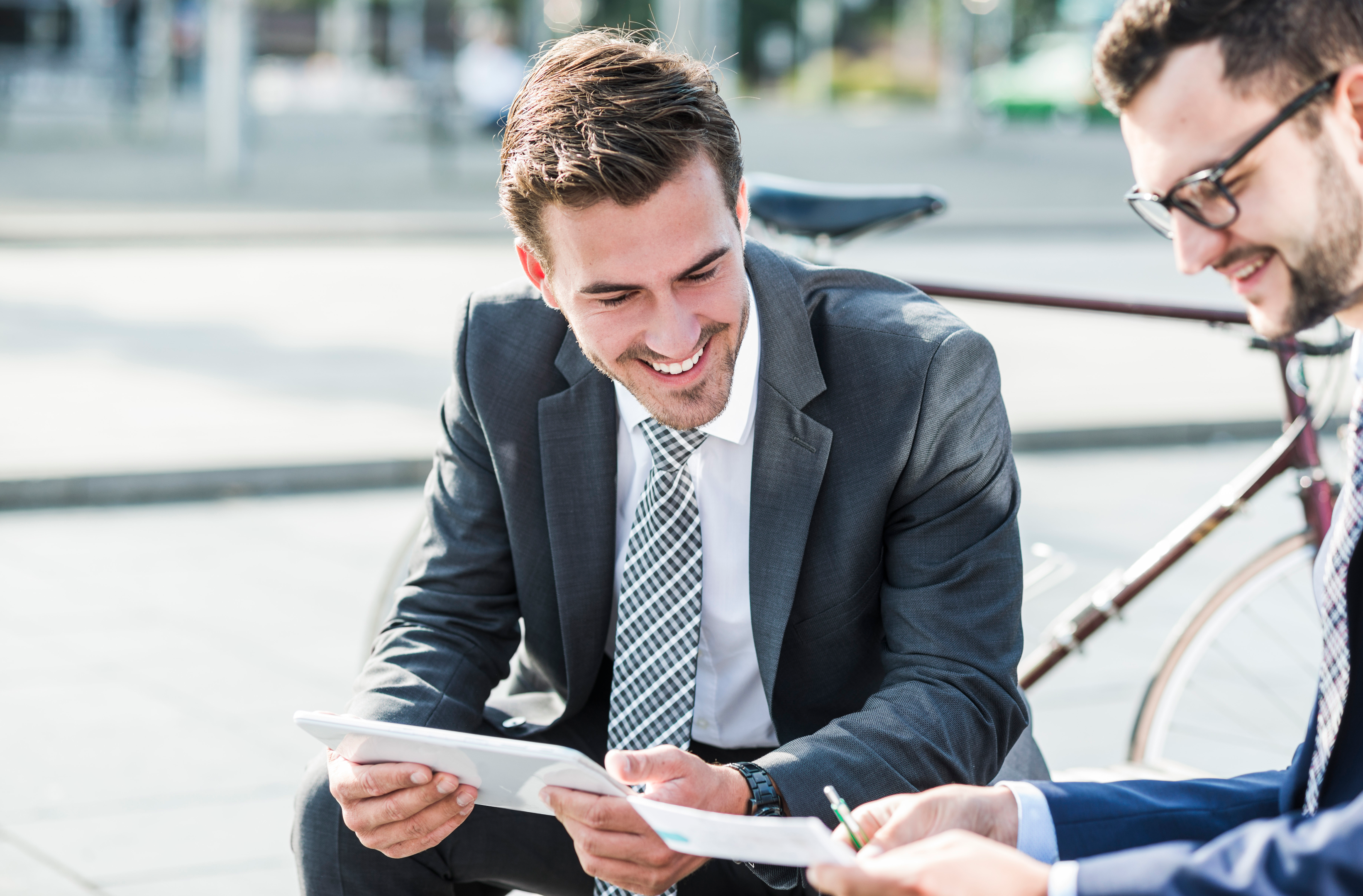 Business men using tablet