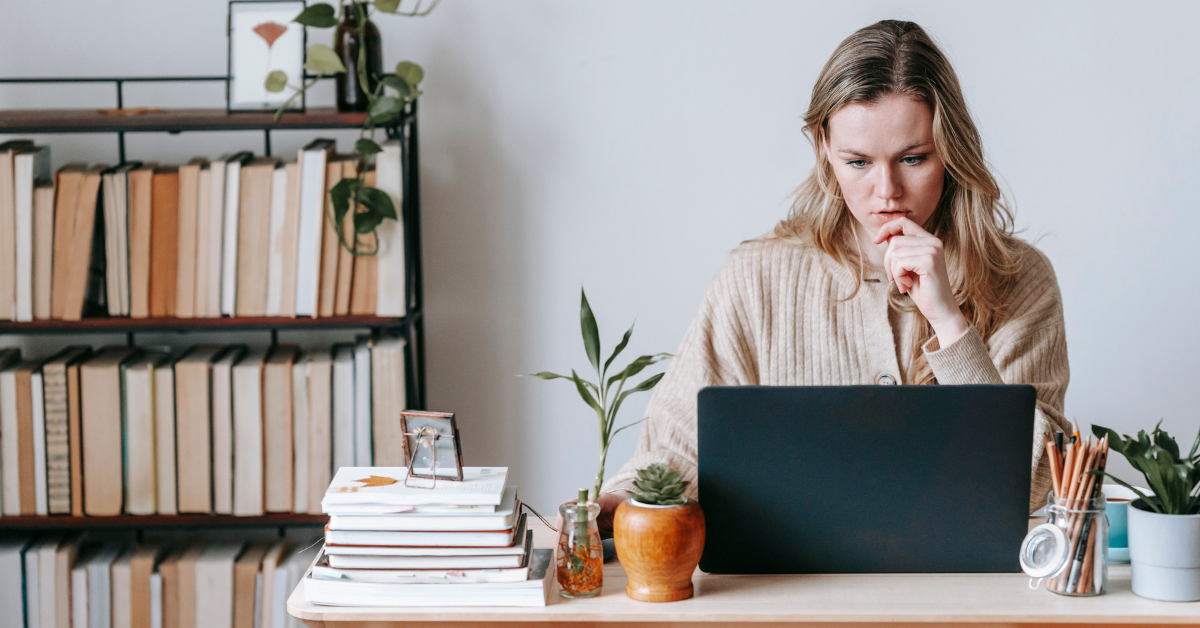  A woman working on laptop "Tax planning" for onlyfans