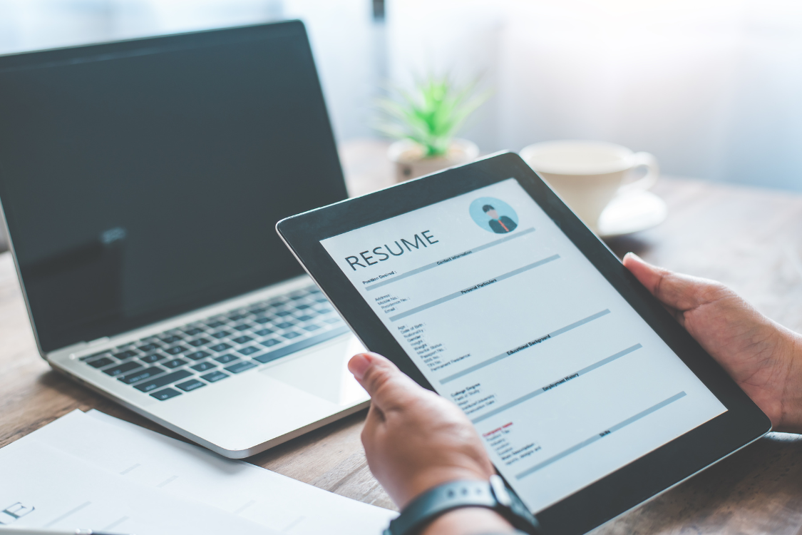 Digital resume displayed on tablet during Filipino applicant screening process