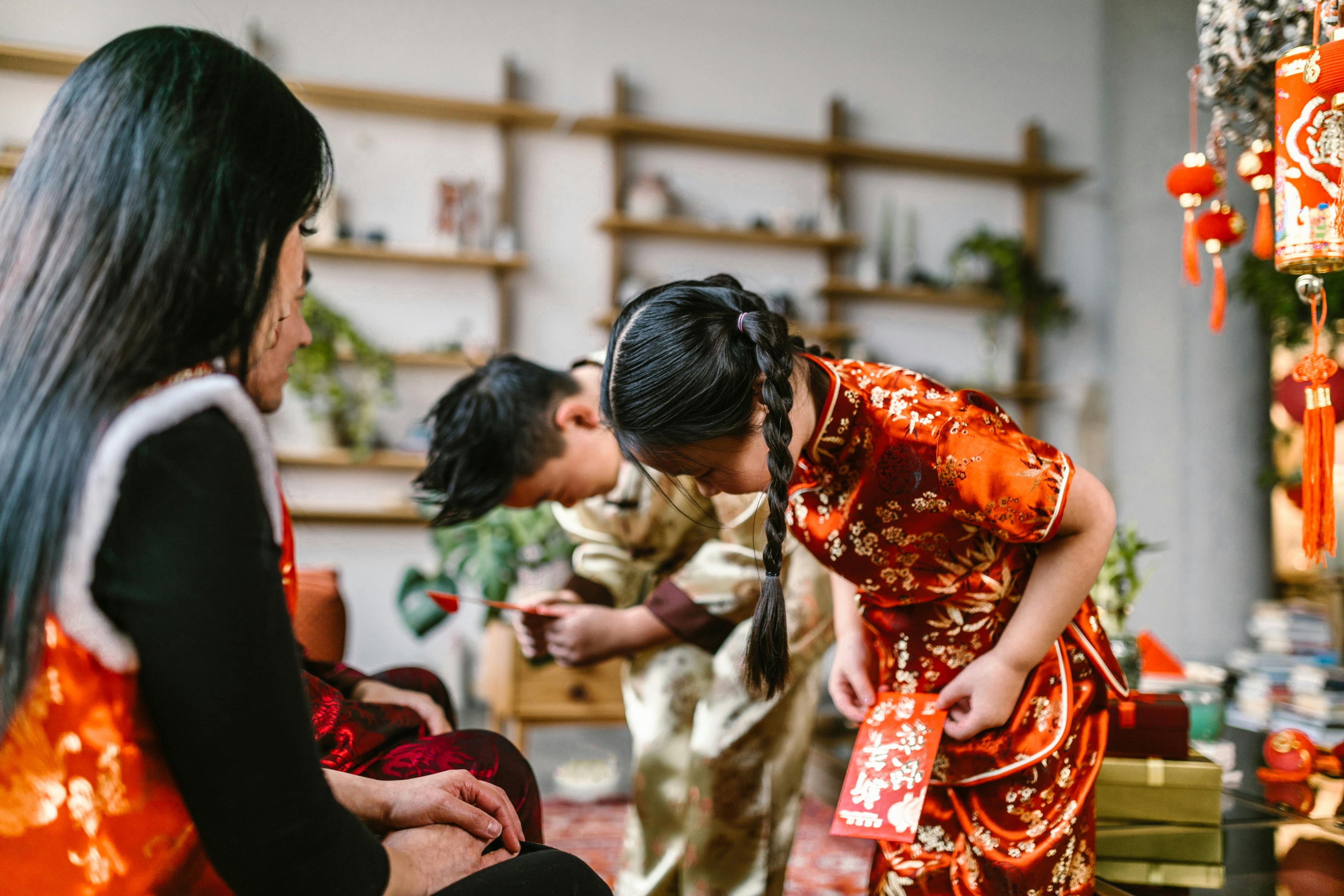 Boy and girl bowing to elders