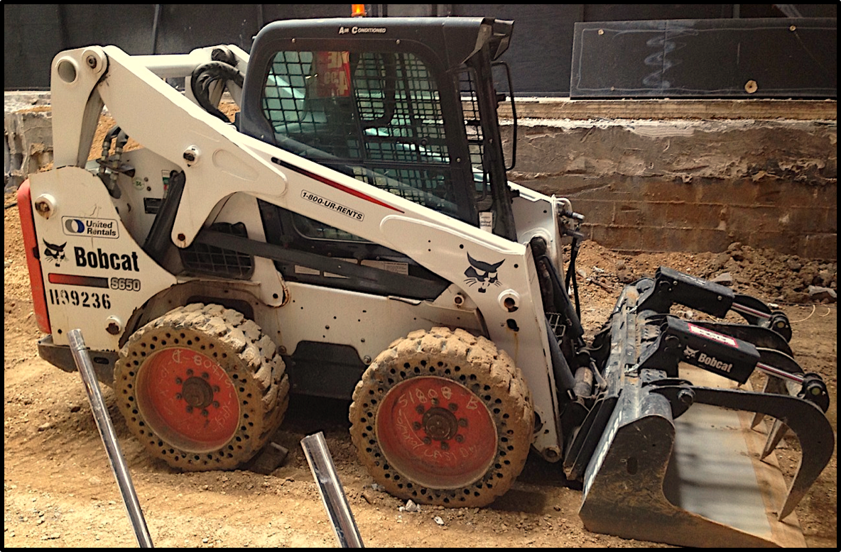 skid steer attachments in construction and landscaping
