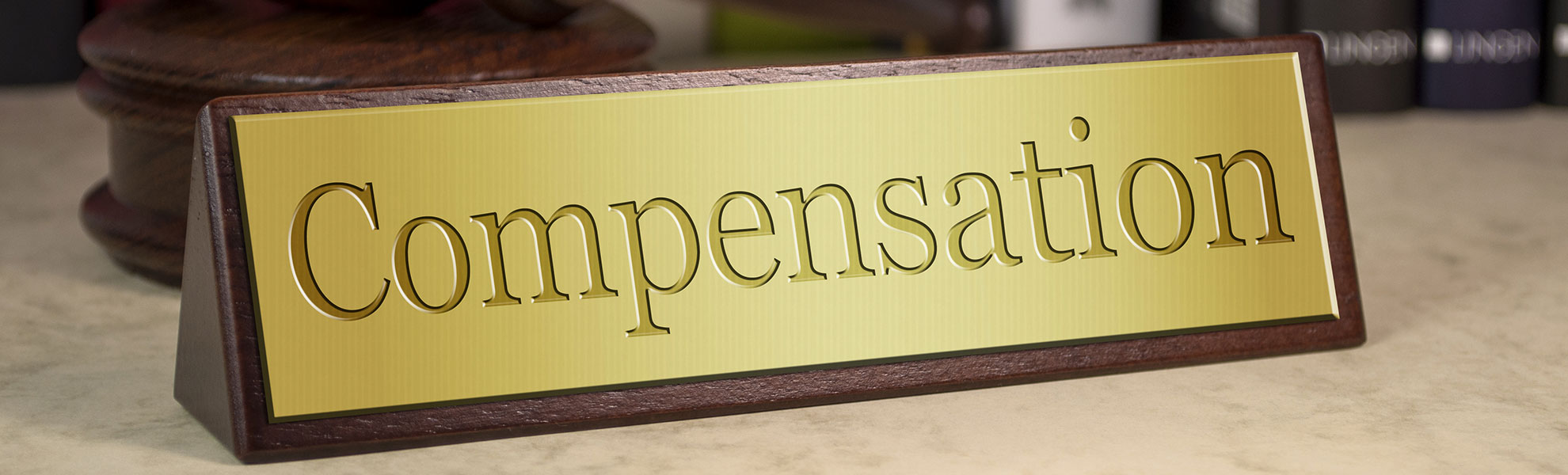 Compensation desk sign.