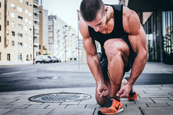 man getting ready to run after injuries- exercises helps strength foot ligaments and muscles, but with caution