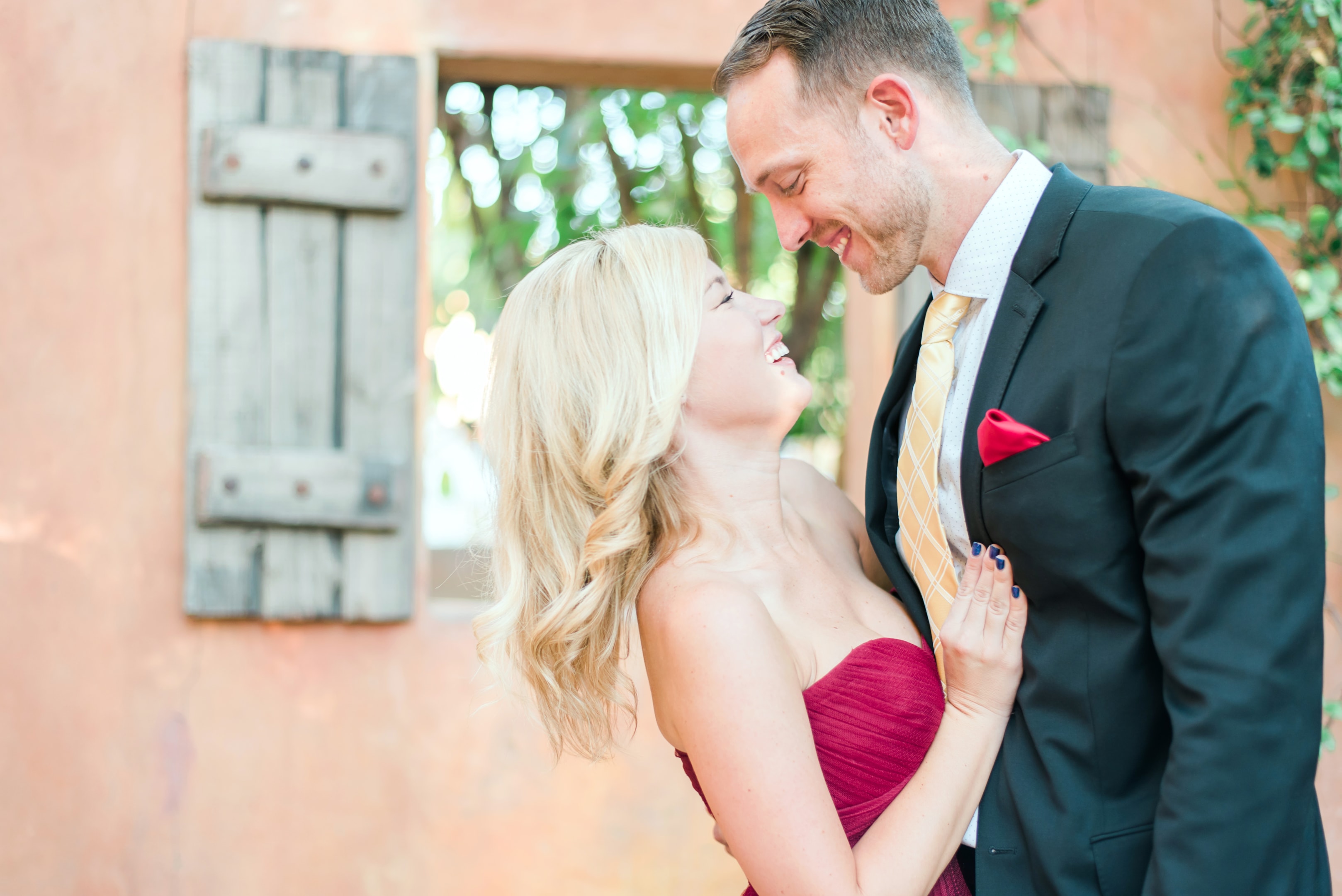 A couple sharing a romantic moment during their engagement session with a wedding photographer in Arizona.