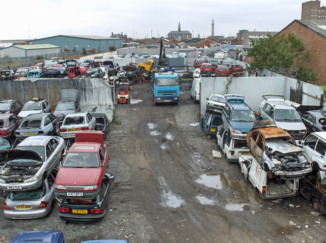 A group of junk cars on a private property