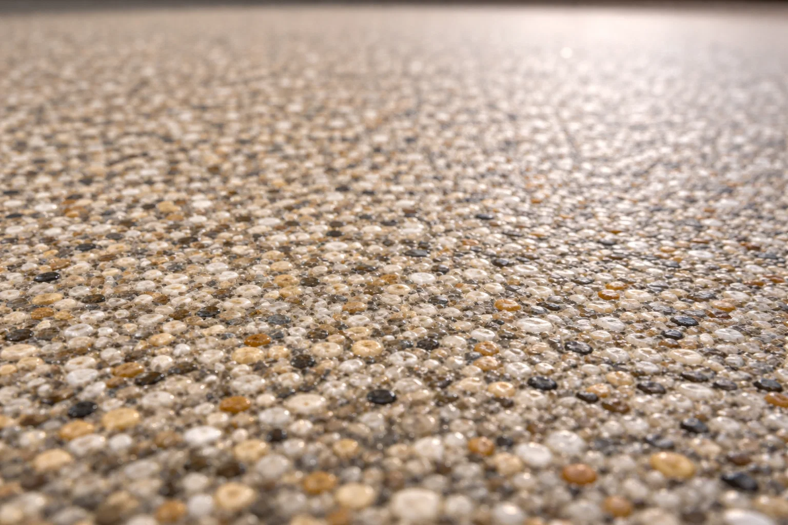 Close-up detail of resin bound driveway surface with natural stone aggregate.