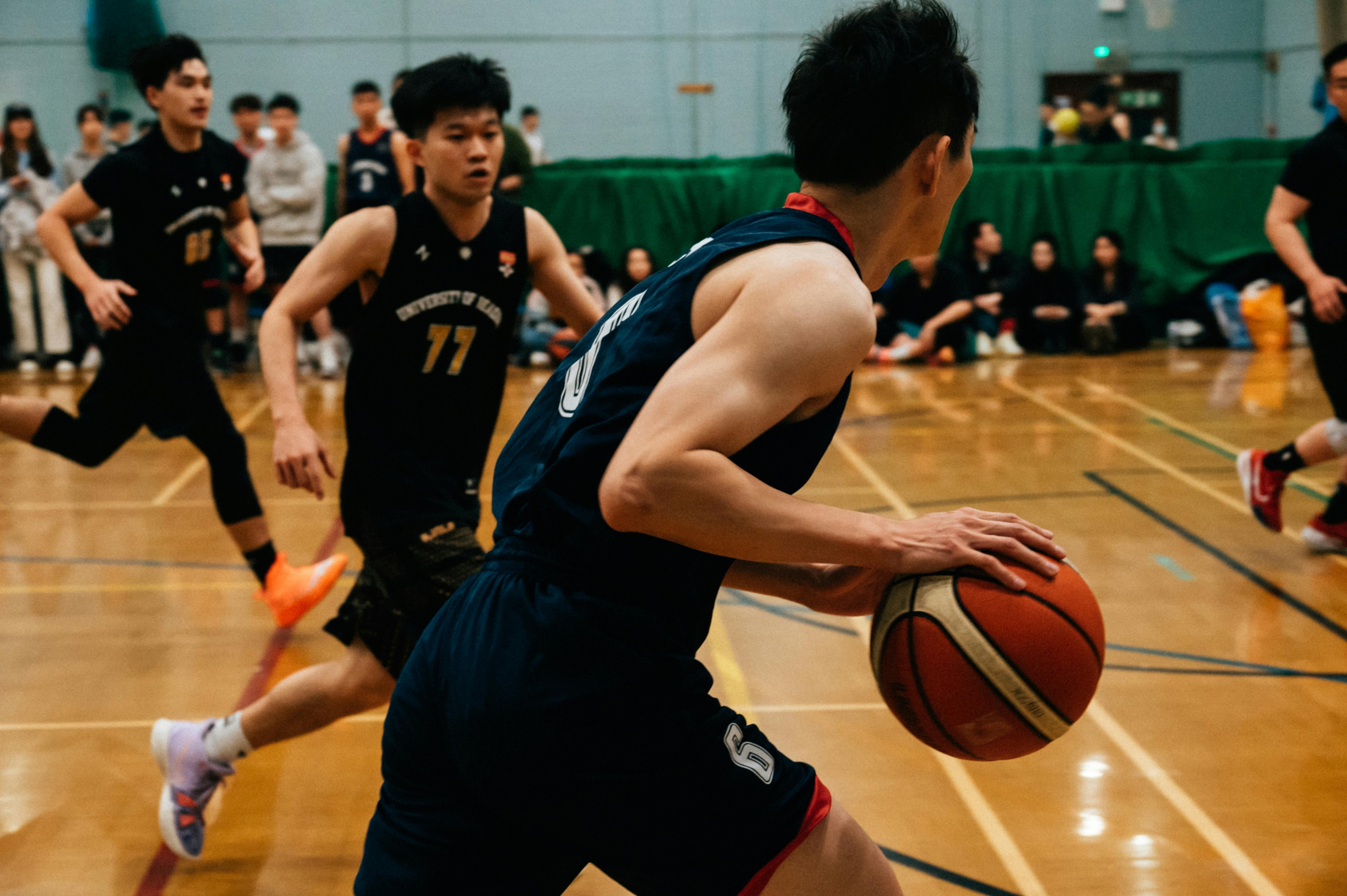 Photo by Zekai Zhu: https://www.pexels.com/photo/close-up-shot-of-a-man-dribbling-ball-11831861/