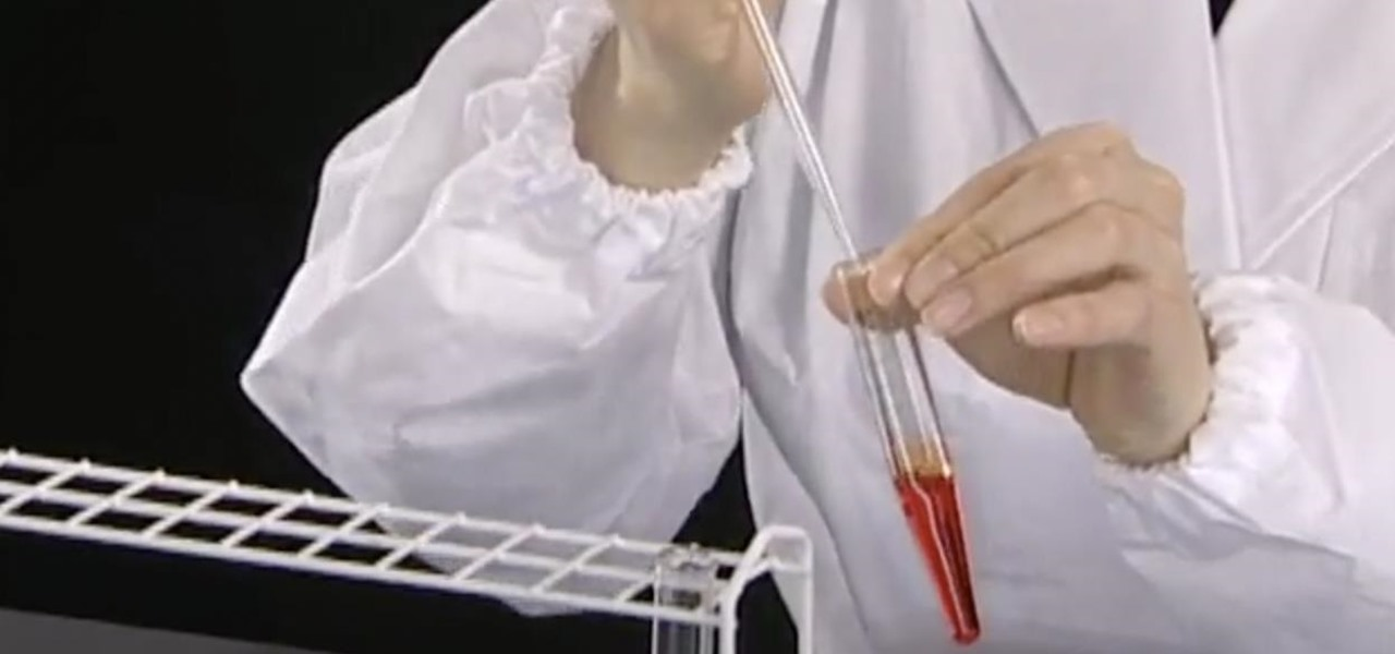 Laboratory scientist using a pipettor for liquid transfer